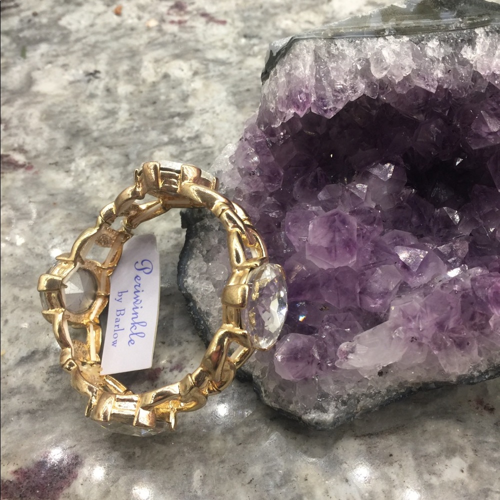 Gold elastic bracelet with 4 large jewels.